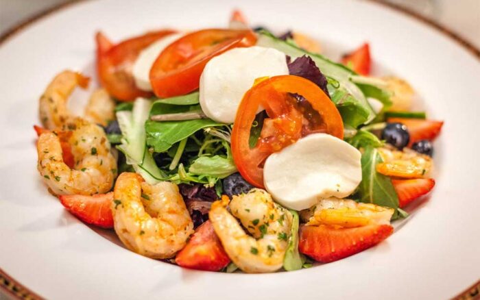 Shrimp salad with fresh cheese and tomatoes